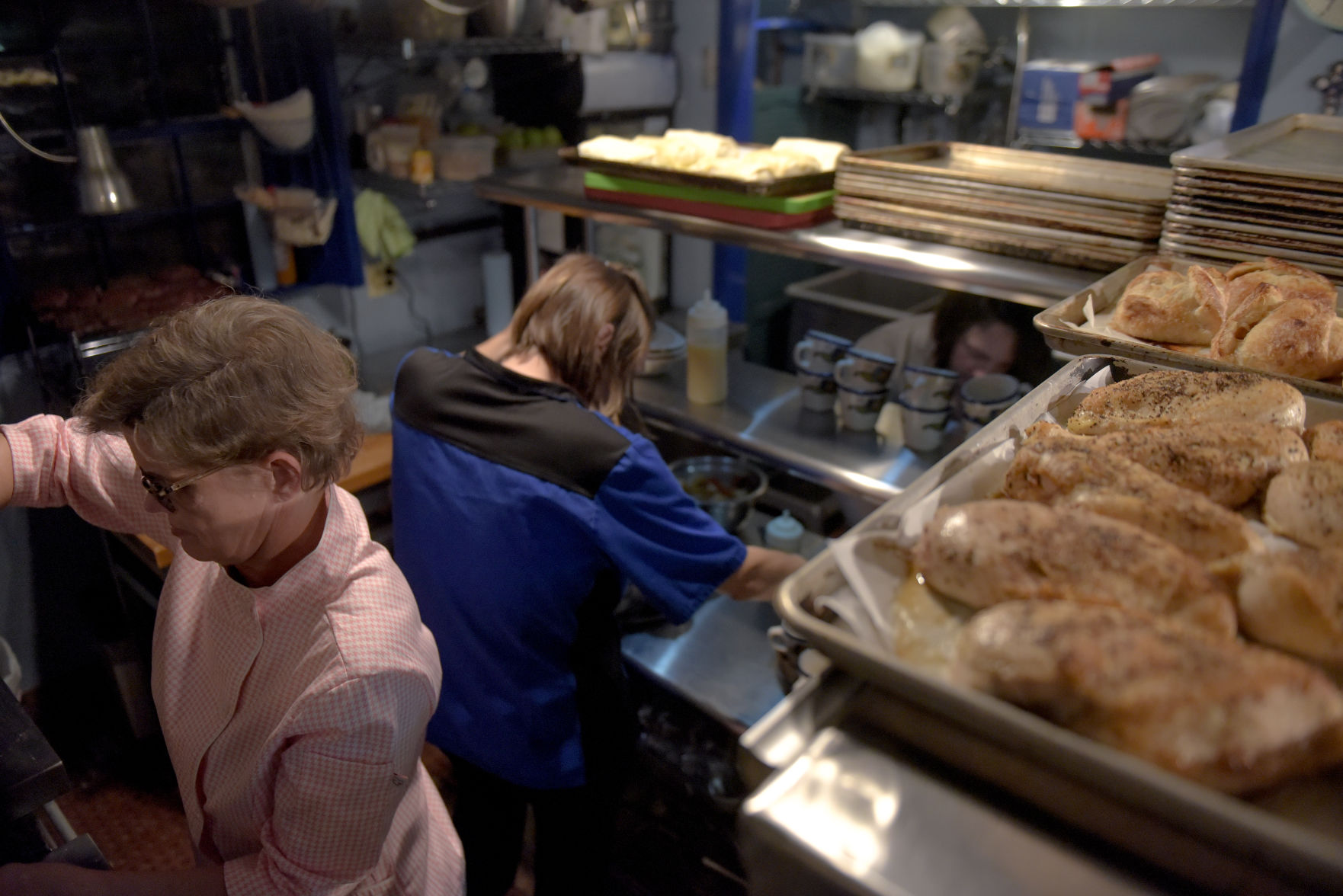 Liz Huff cooks circular ribeye cuts in the kitchen